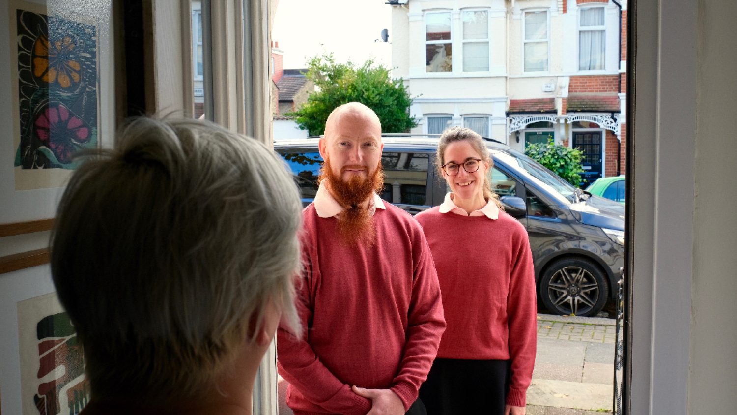 Two members of Poppy's staff on doorstep at a home collection