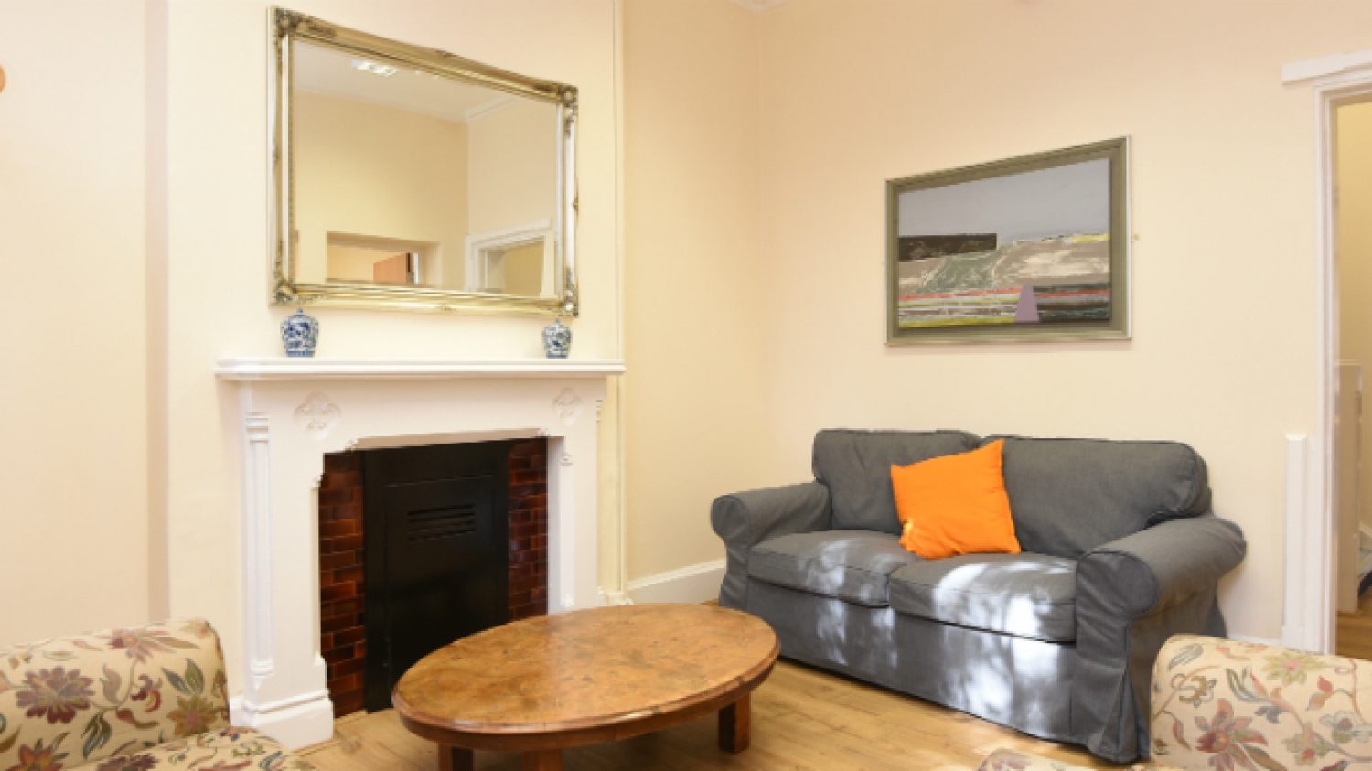 Inside Poppy's HQ, sofas, pictures and fireplace