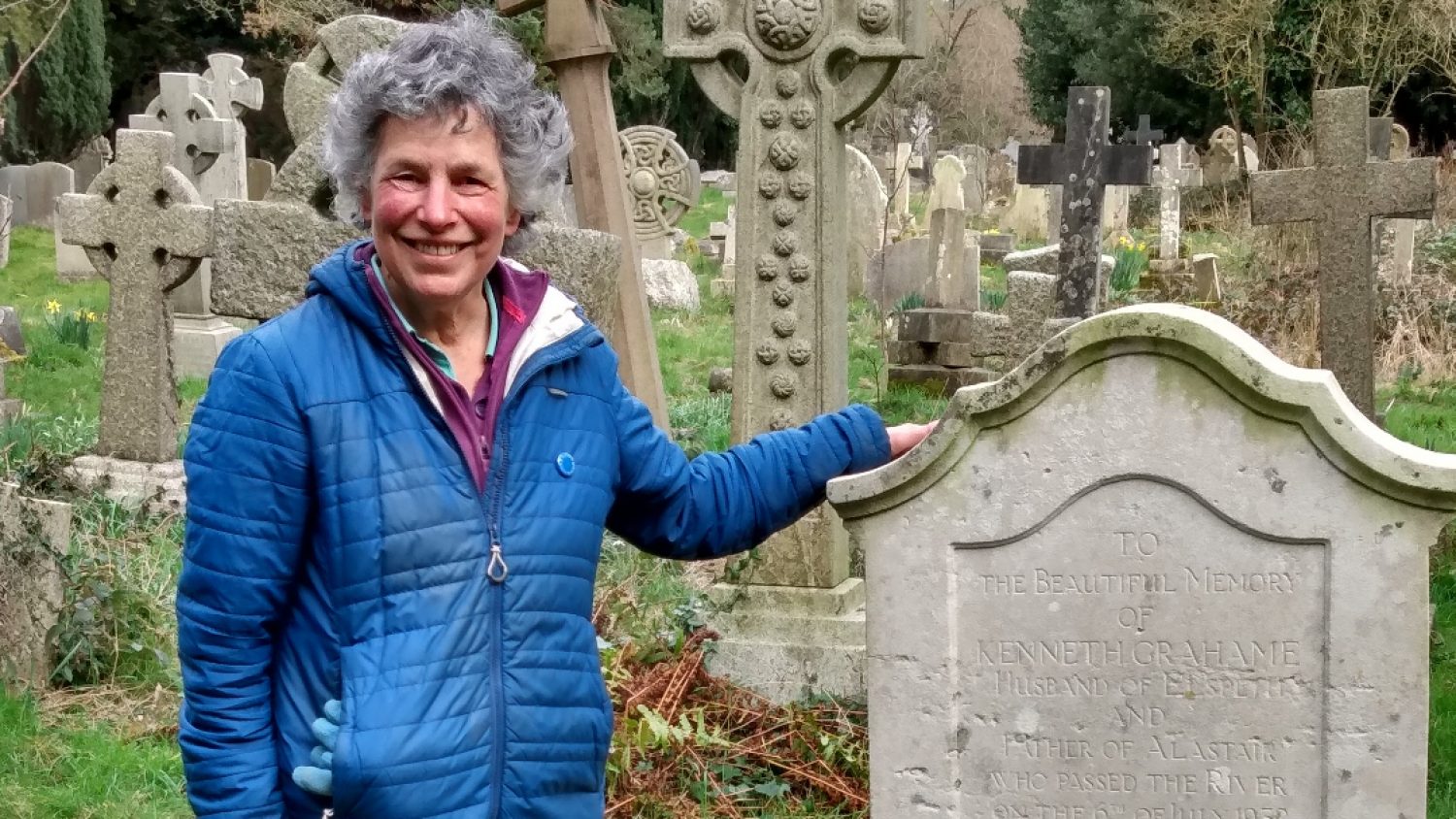 Nina Morgan, Gravestone Geologist standing by Kenneth Graeme's grave, Poppy's, London funeral directors