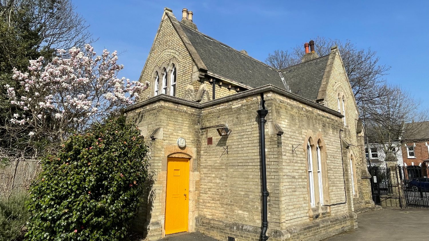 Poppy's HQ, the gatehouse in Lambeth cemetery, with spring blossom