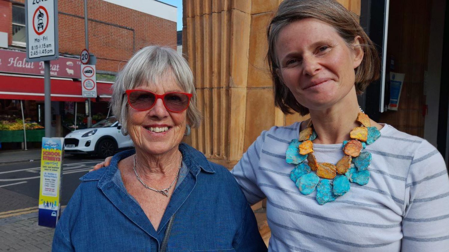 Tonie Greig and Poppy Mardall outside Tooting Library