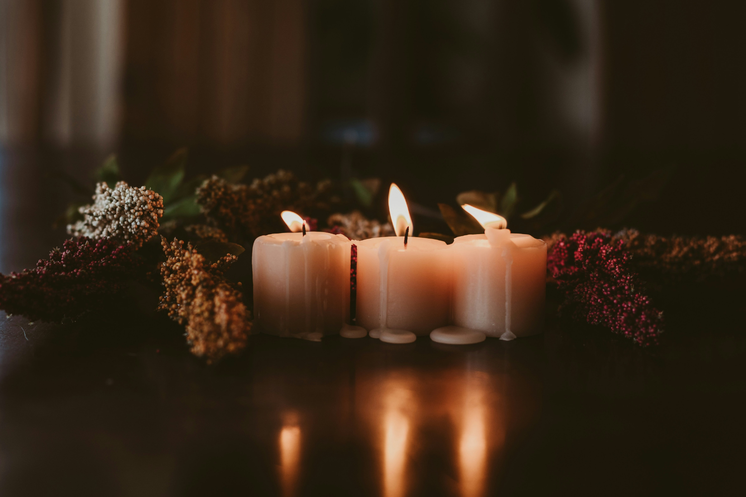 candles and dried flowers to mark a death anniversary