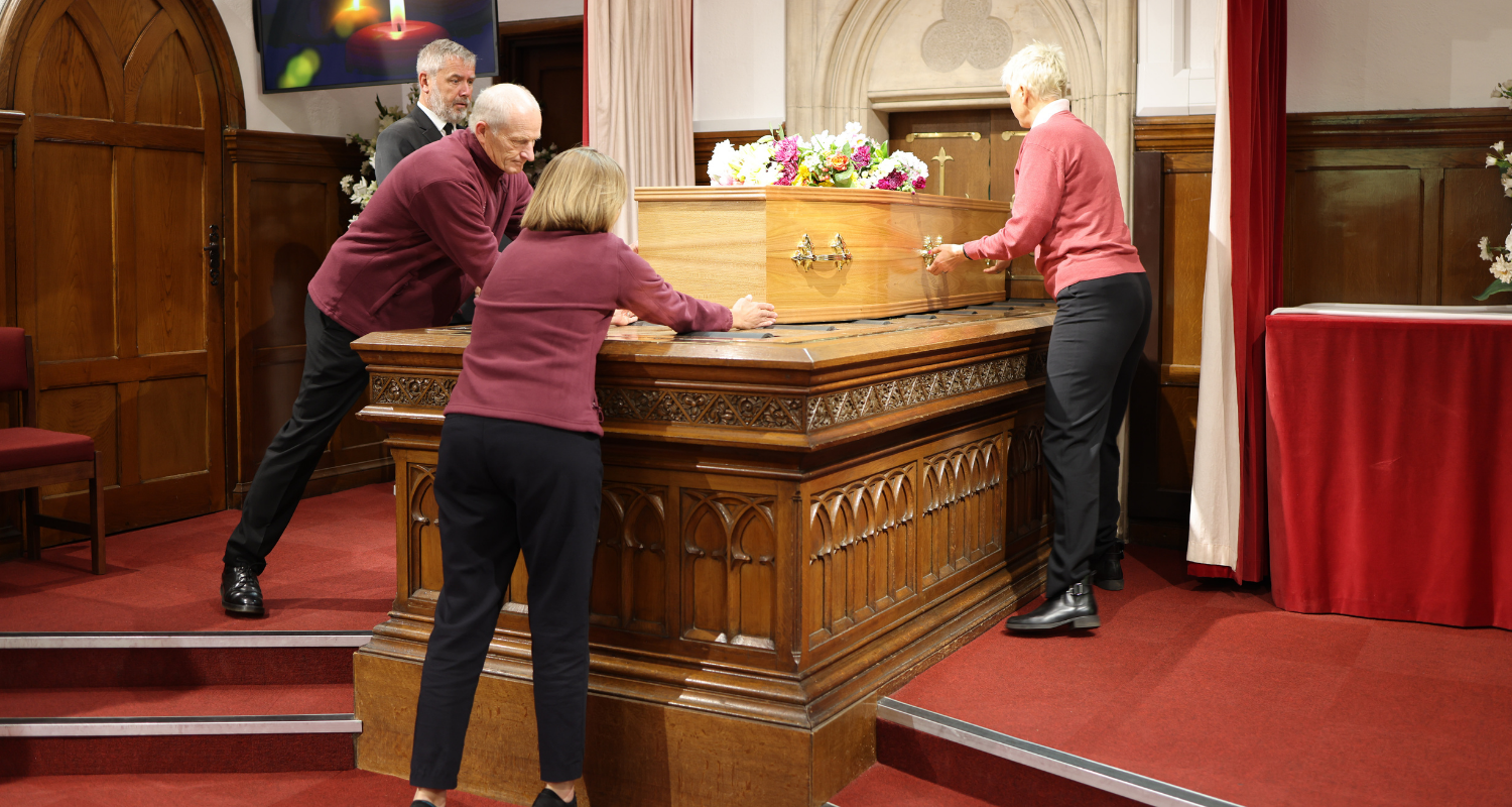 Hannah and PLs place coffin on catafalque