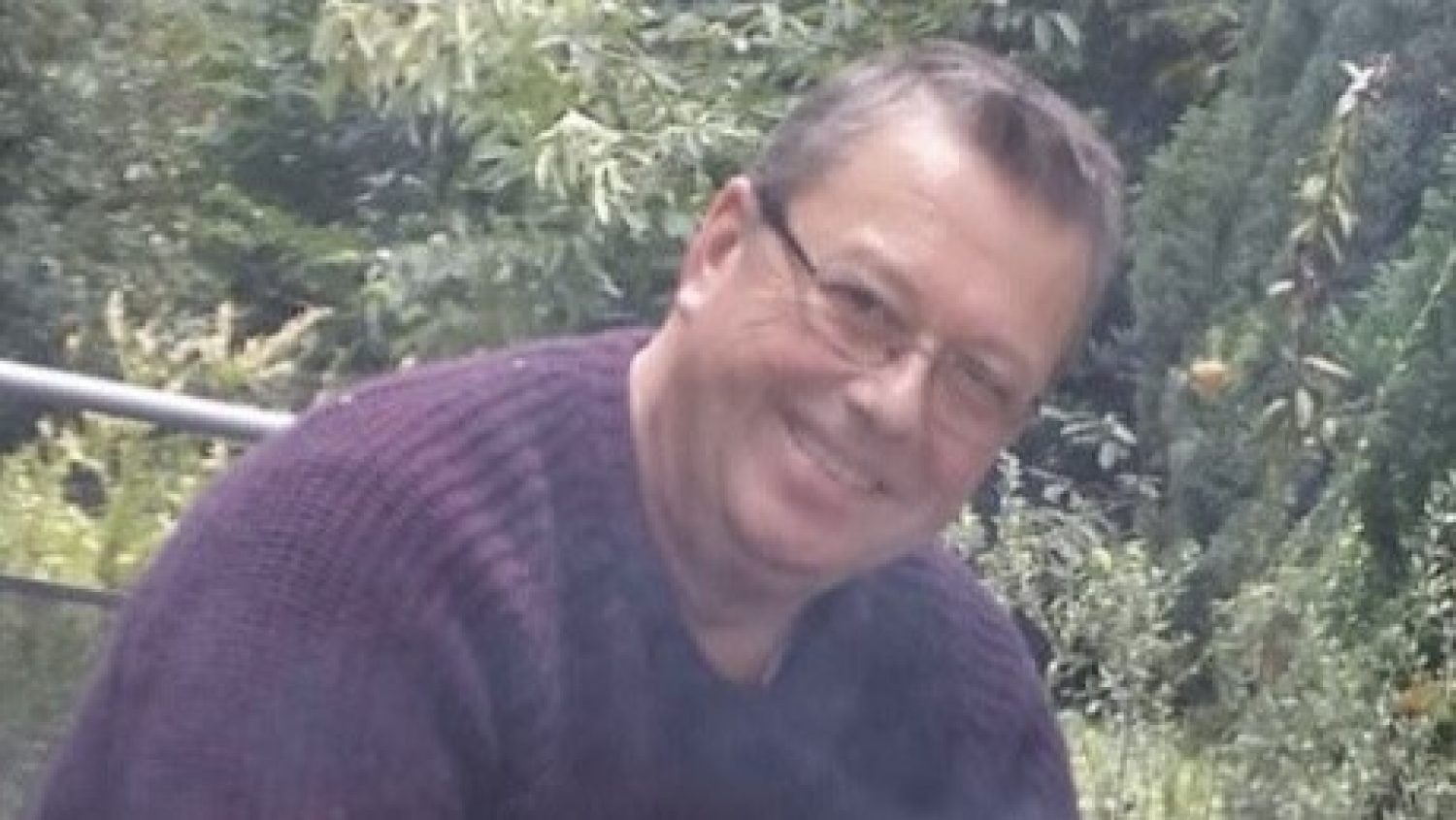Vincent Henshaw, white man in glasses, smiling, with garden in background