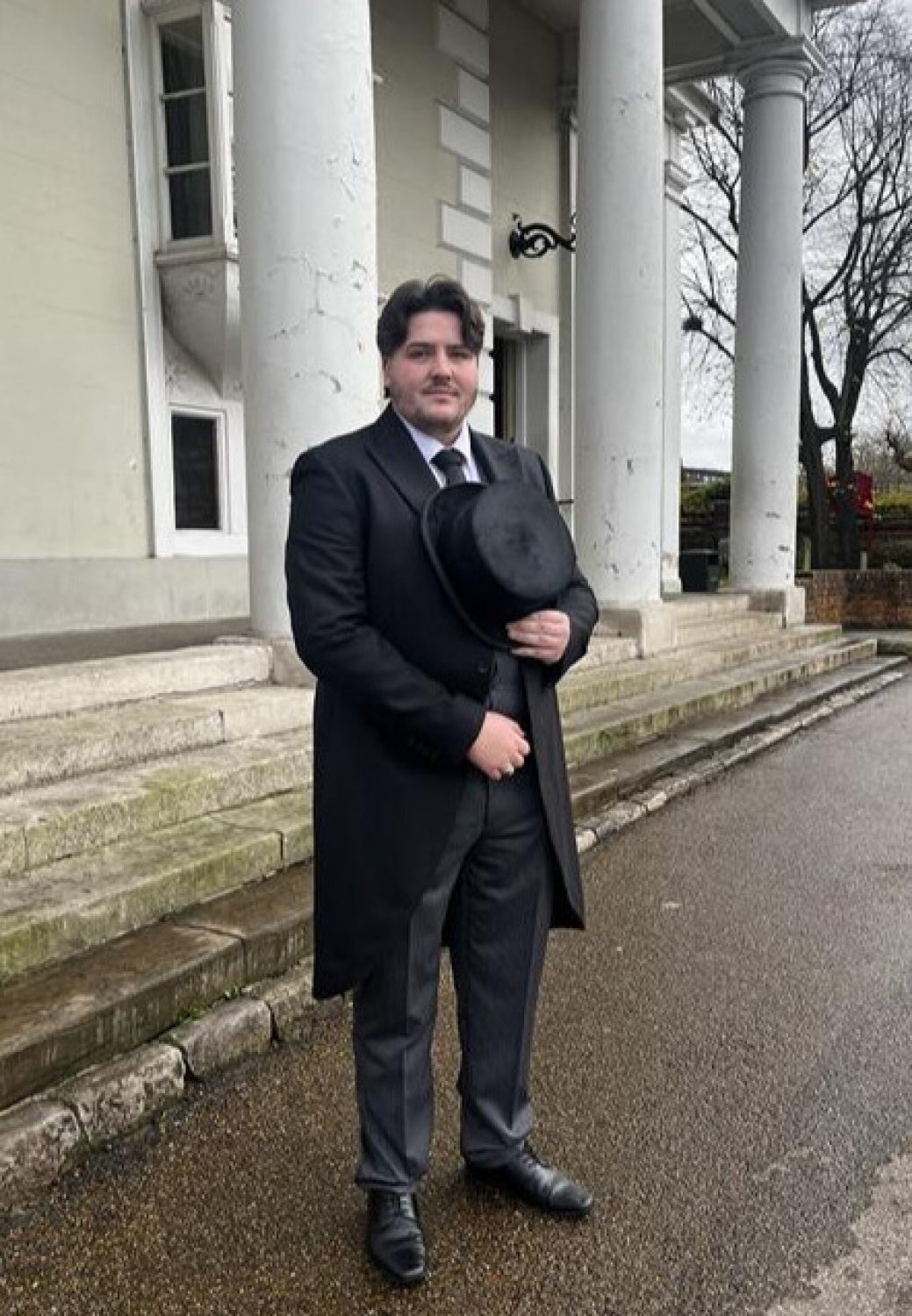 Liam Thackray Senior Practical Lead in smart black morning suit and hat