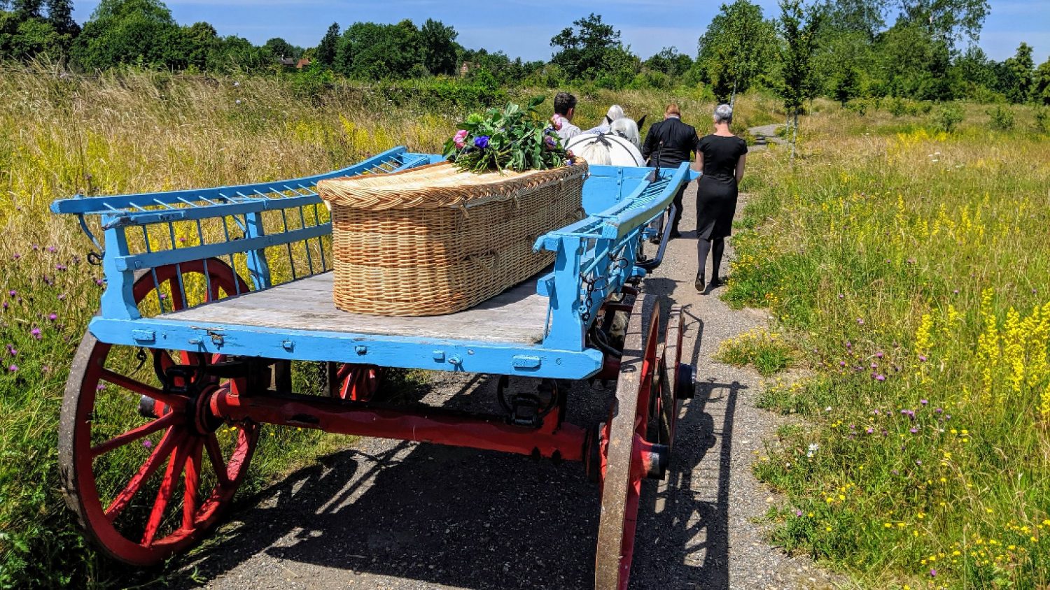 Coffin on horse and cart at natural burial site, Poppy's funerals, London funeral director