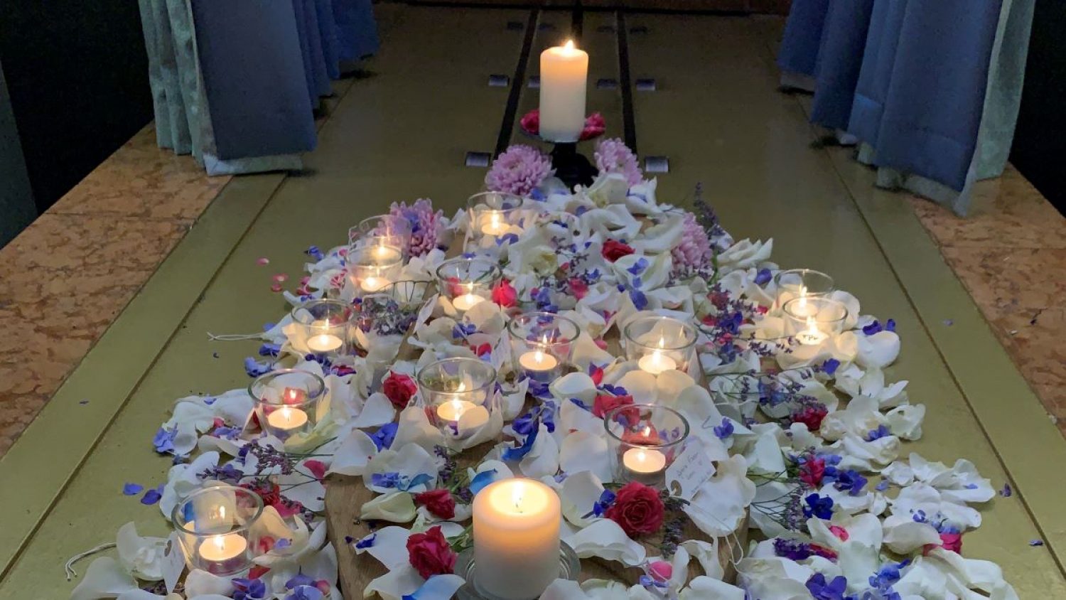Candles and petals as part of Baby Loss Awareness Week wave of light