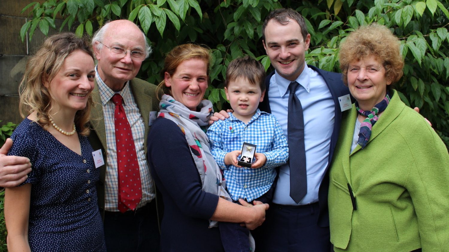 Will's family with his medal for organ donation | Poppy's funerals | London funerals