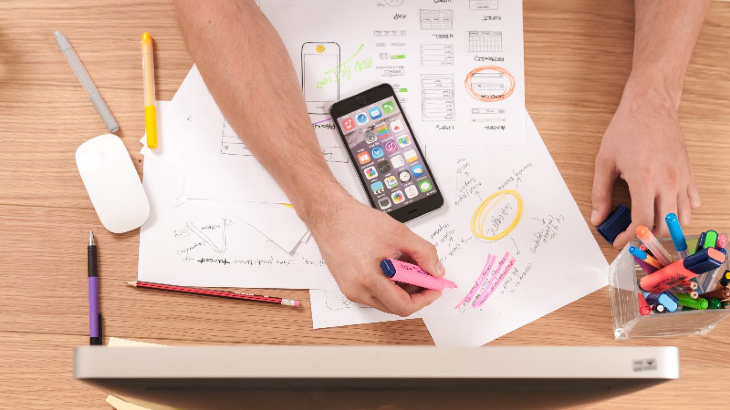 Person with phone and computer, writing notes on paper |Firmbee com gcs N Os PE Xfs unsplash | Poppy's funerals
